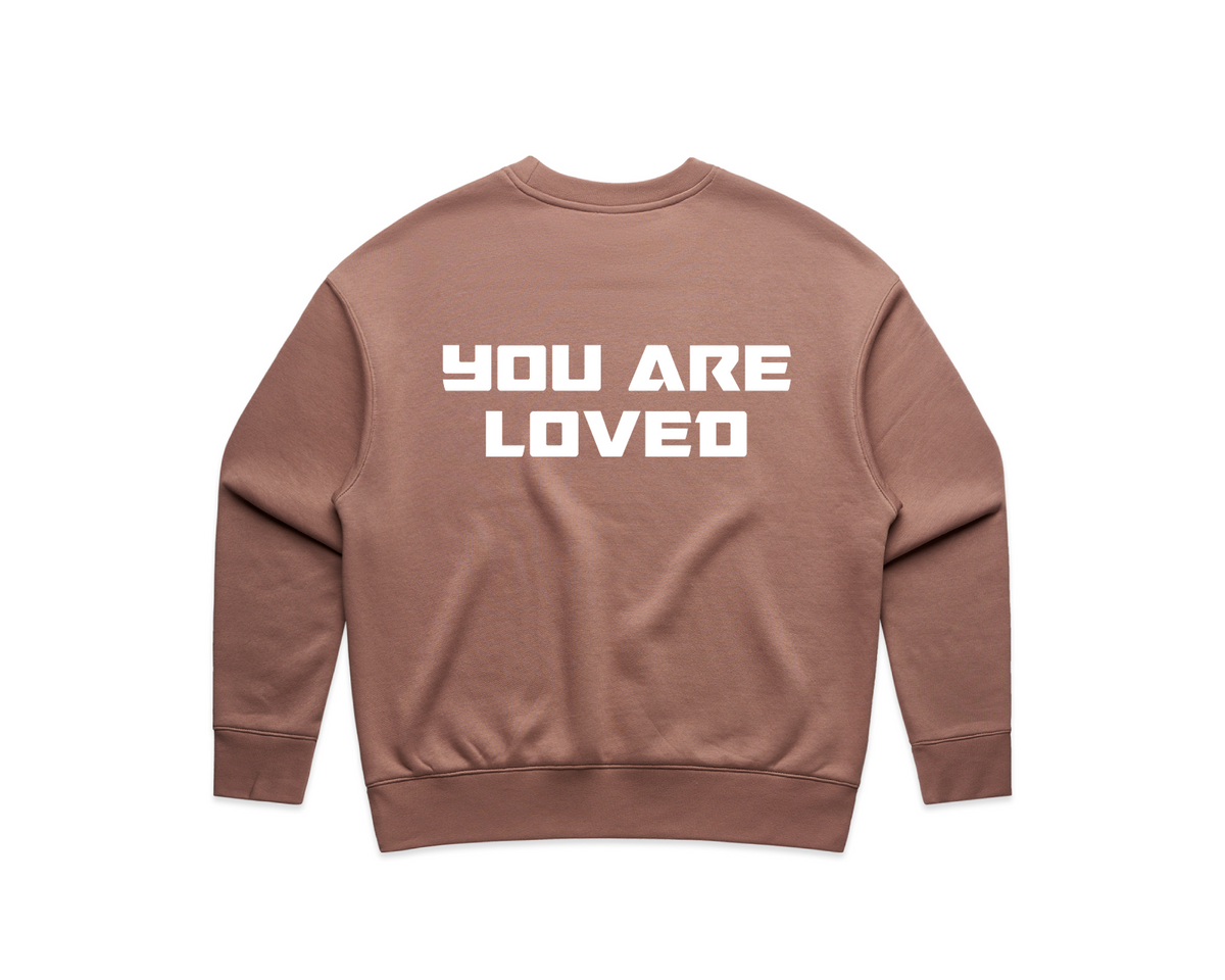Brown crew neck sweatshirt from DMROZE WOMEN'S PRINTED CREW NECKS with relaxed fit and white text print reading 'YOU ARE LOVED' on back